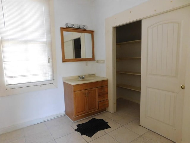 bathroom featuring tile patterned floors and vanity