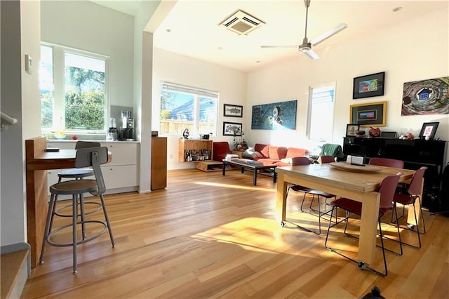 interior space with light hardwood / wood-style flooring, ceiling fan, and a healthy amount of sunlight