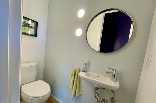 bathroom with toilet and sink