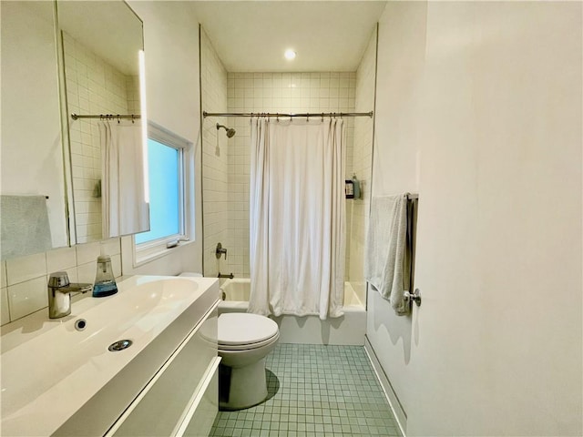 full bathroom featuring tile patterned flooring, shower / tub combo, vanity, and toilet