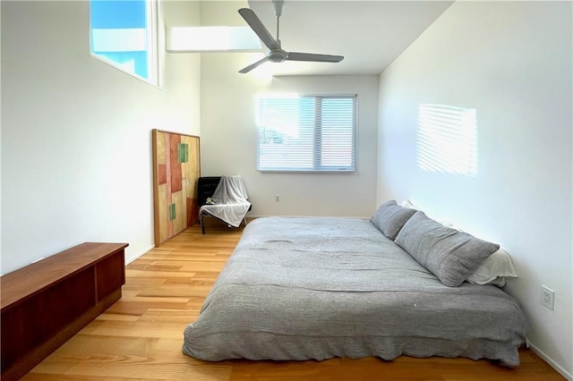 bedroom featuring light wood-type flooring and ceiling fan