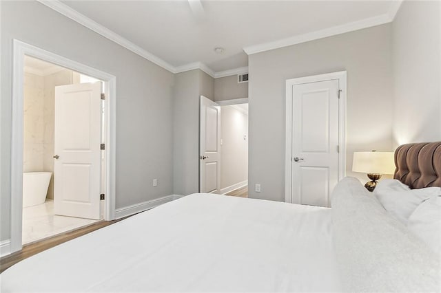 1908-10 St Louis St, New Orleans, LA 70112 - bedroom featuring ornamental molding and wood finished floors