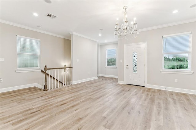 1908-10 St Louis St, New Orleans, LA 70112 - entrance foyer featuring a chandelier, light wood-style floors, crown molding, and recessed lighting