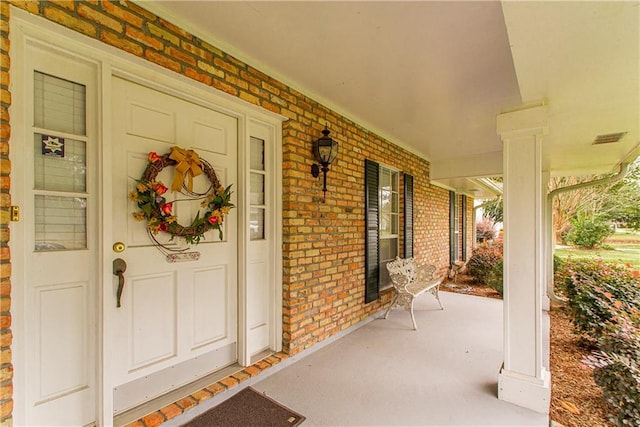 property entrance featuring covered porch