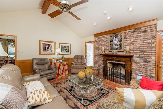 tiled living room with ceiling fan, a fireplace, and lofted ceiling with beams