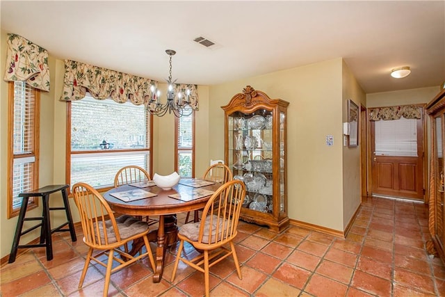 dining area featuring a notable chandelier