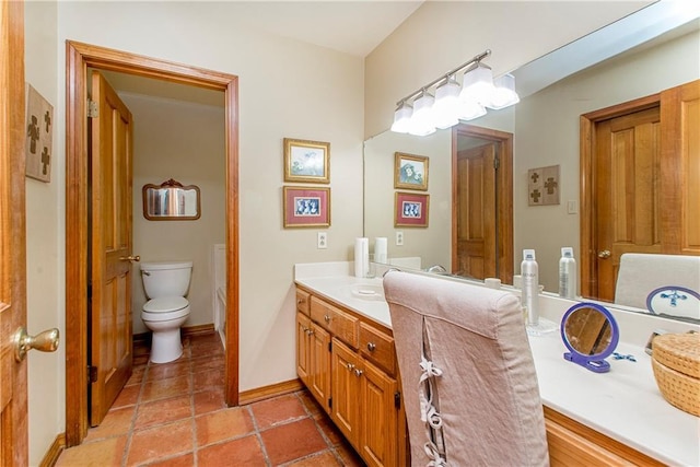 bathroom with vanity and toilet