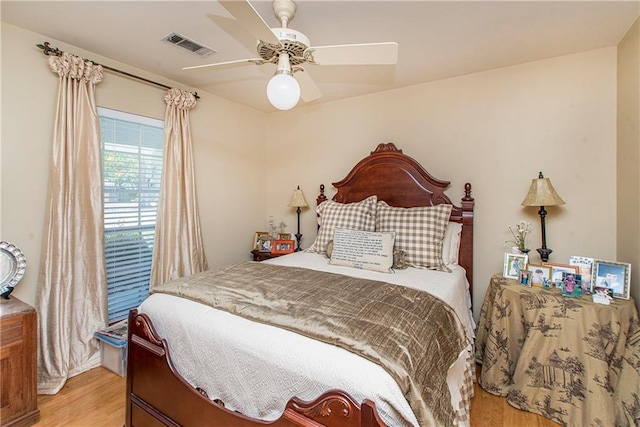 bedroom featuring ceiling fan and light hardwood / wood-style flooring