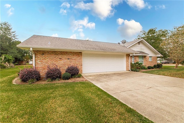 single story home with a garage and a front lawn