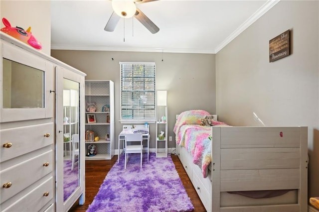 bedroom featuring crown molding, ceiling fan, and dark wood-type flooring