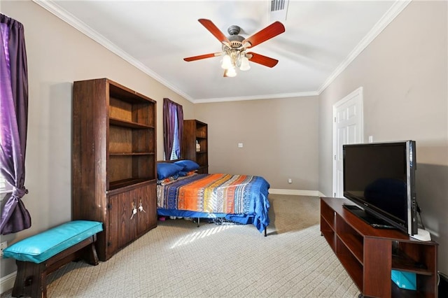 carpeted bedroom with ceiling fan and crown molding