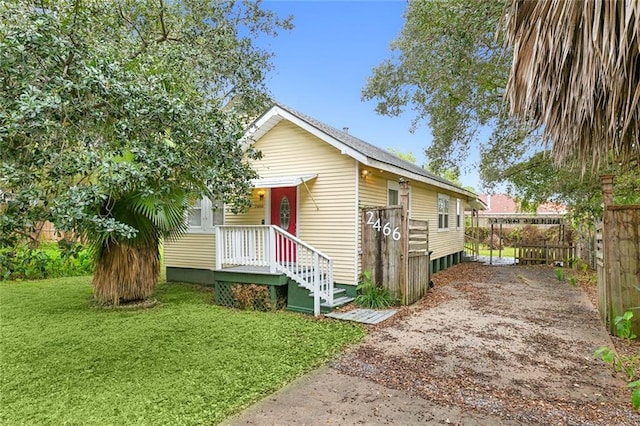 2466 Behrman Hwy, New Orleans, LA 70114 - bungalow featuring a front lawn