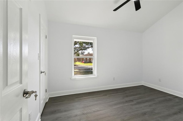 spare room with ceiling fan and dark hardwood / wood-style flooring