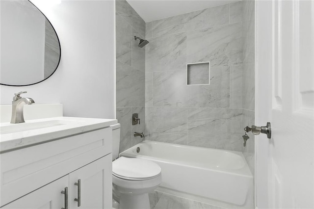 full bathroom featuring vanity, toilet, and tiled shower / bath combo