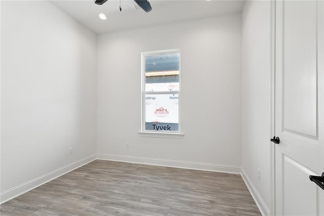 empty room featuring ceiling fan and hardwood / wood-style floors