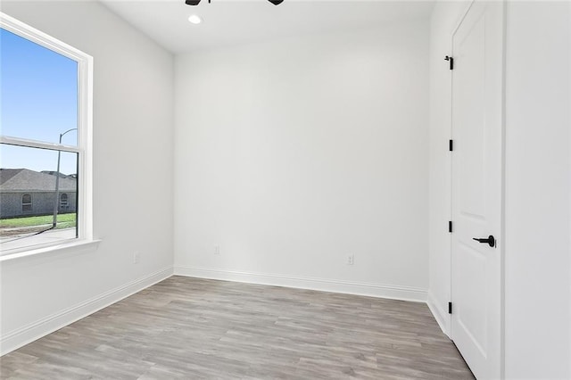 unfurnished room featuring ceiling fan and light hardwood / wood-style floors