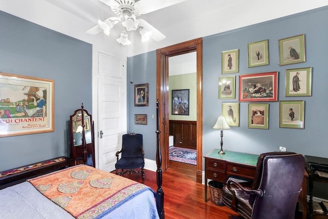 bedroom with ceiling fan and dark hardwood / wood-style floors