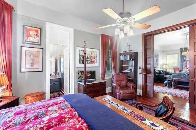 bedroom with ceiling fan, dark hardwood / wood-style flooring, and ensuite bathroom