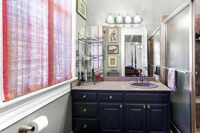 bathroom featuring vanity and an enclosed shower