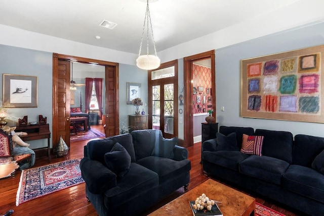 living room featuring hardwood / wood-style floors and french doors