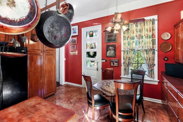 dining space featuring ceiling fan