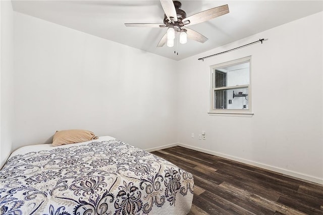 bedroom featuring ceiling fan and dark hardwood / wood-style floors