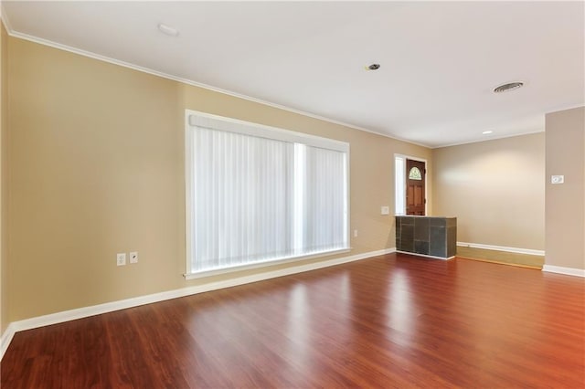 interior space featuring crown molding and wood-type flooring