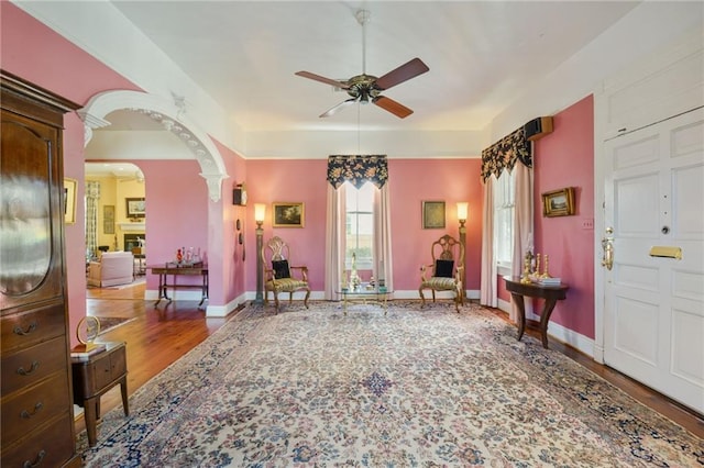 entrance foyer with ceiling fan and wood-type flooring