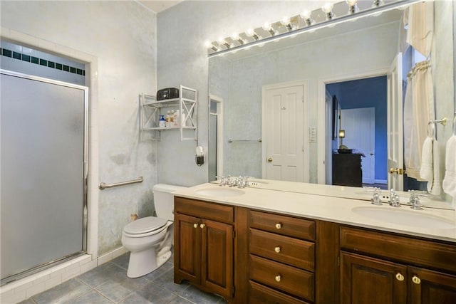 bathroom with tile patterned flooring, vanity, toilet, and walk in shower