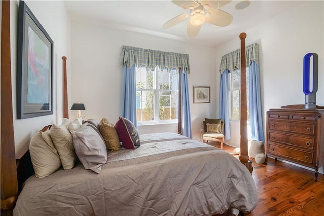 bedroom featuring ceiling fan and dark hardwood / wood-style flooring