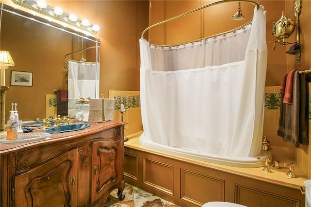 bathroom with vanity and shower / tub combo with curtain