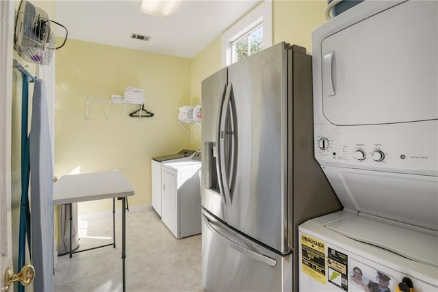 washroom with stacked washer and dryer