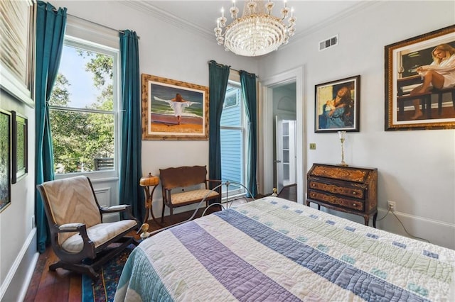 bedroom featuring ornamental molding, an inviting chandelier, and dark hardwood / wood-style flooring