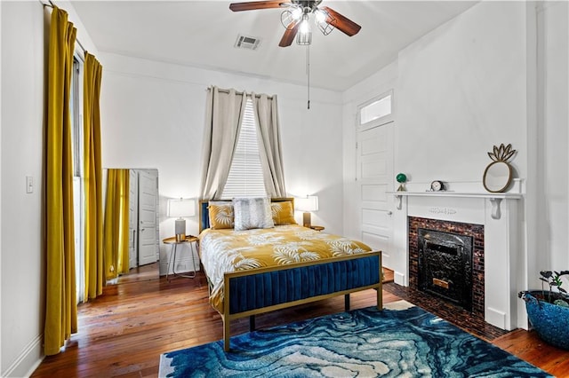 bedroom with hardwood / wood-style floors and ceiling fan