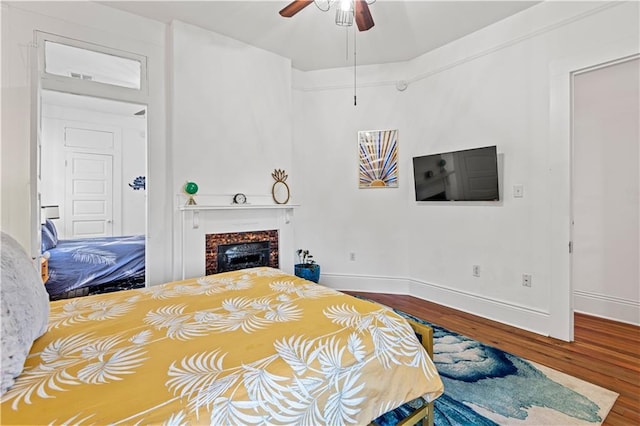 bedroom featuring ceiling fan and wood-type flooring