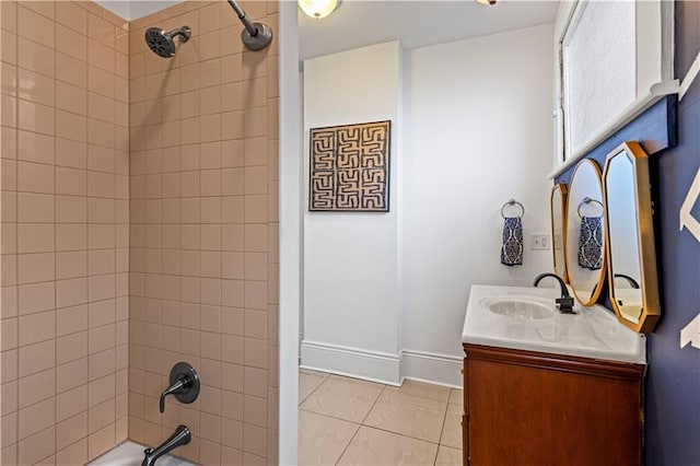 bathroom featuring vanity, tiled shower / bath combo, and tile patterned floors