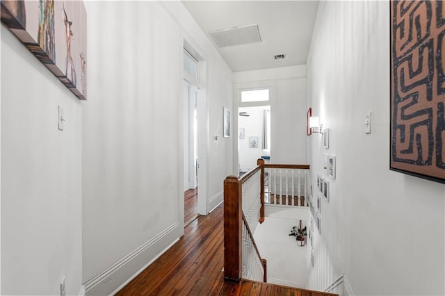 corridor with dark wood-type flooring