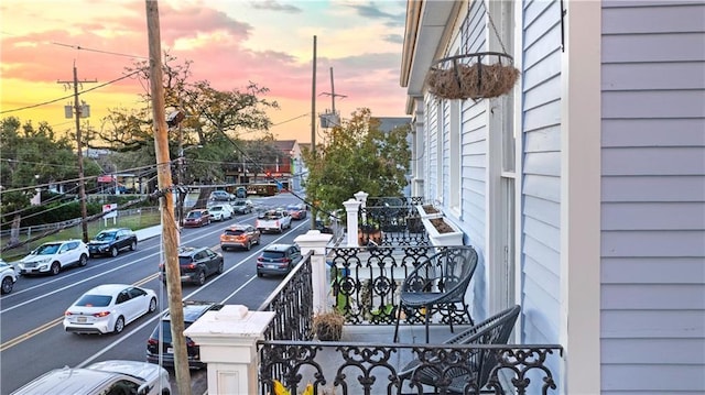 view of balcony at dusk