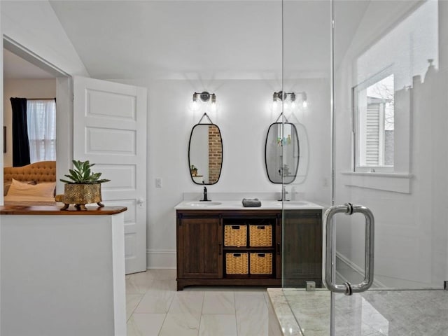 bathroom with vanity, plenty of natural light, and lofted ceiling