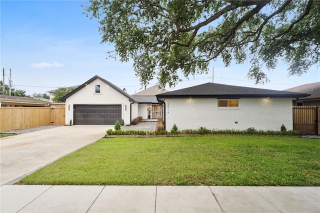 single story home featuring a garage and a front lawn