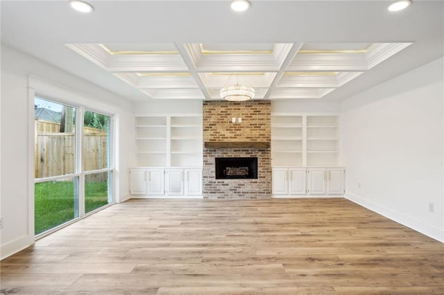 2914 Ridgeway Dr, Metairie, LA 70002 - unfurnished living room featuring built in features, light wood-type flooring, recessed lighting, crown molding, and a chandelier