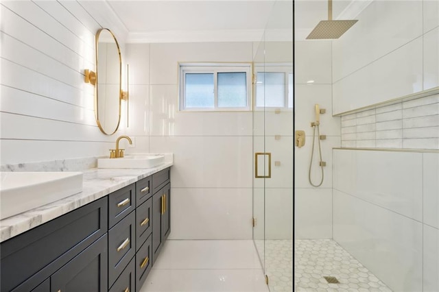 2914 Ridgeway Dr, Metairie, LA 70002 - full bathroom featuring a stall shower, double vanity, ornamental molding, and tile walls
