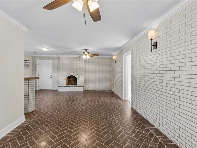 unfurnished living room with crown molding, a fireplace, ceiling fan, and brick wall