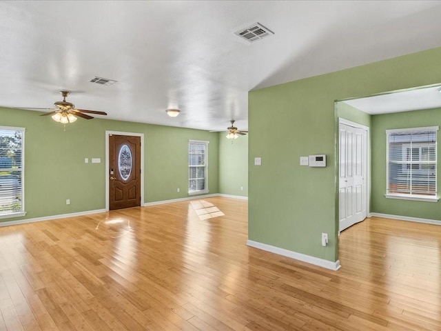 foyer entrance with light hardwood / wood-style flooring