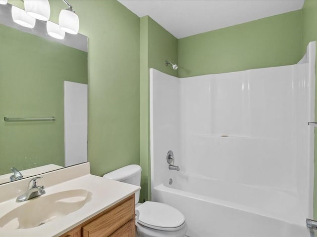 full bathroom with shower / tub combination, vanity, and toilet