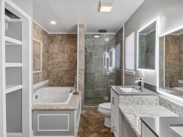 full bathroom featuring vanity, hardwood / wood-style floors, plus walk in shower, and toilet