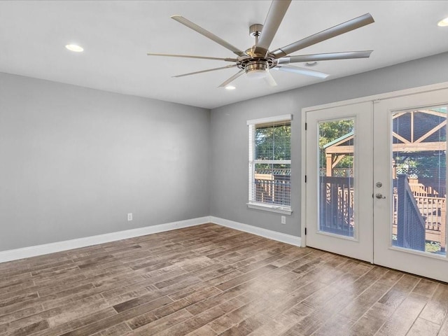 doorway with french doors, ceiling fan, and hardwood / wood-style floors