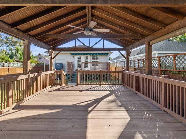 wooden terrace featuring a gazebo and ceiling fan