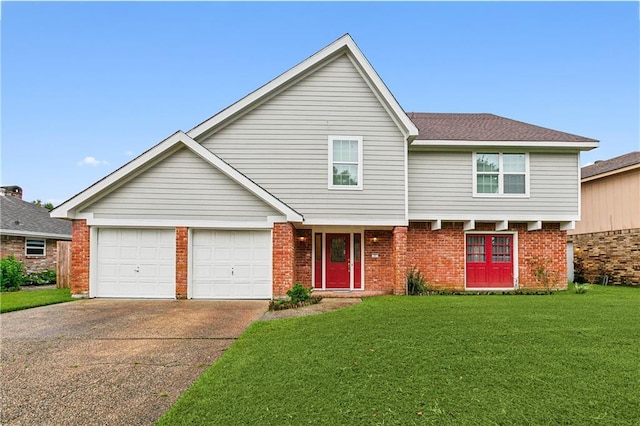 view of front of home featuring a garage and a front yard