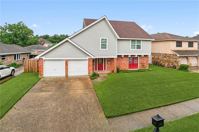 view of front of house with a garage and a front lawn